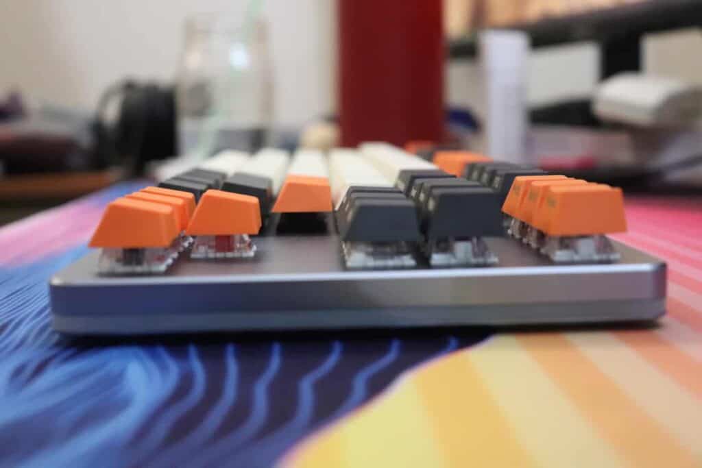 Side view of a mechanical keyboard with PBT keycaps.