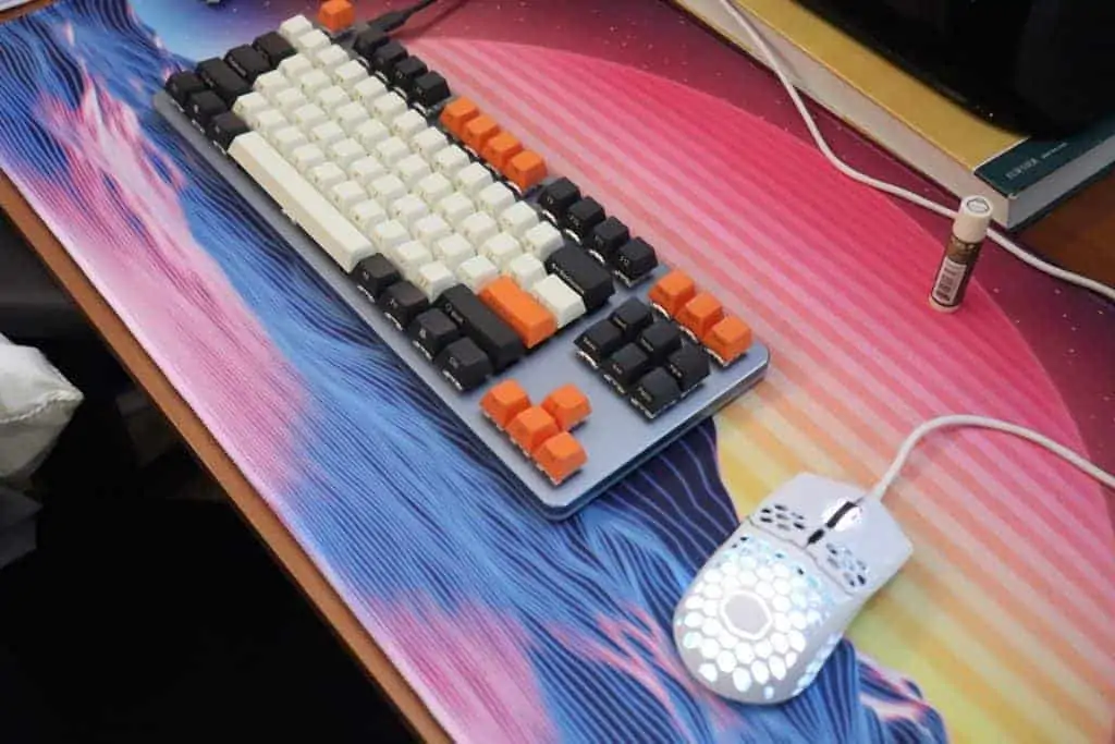 mechanical keyboard and mouse on a deskmat