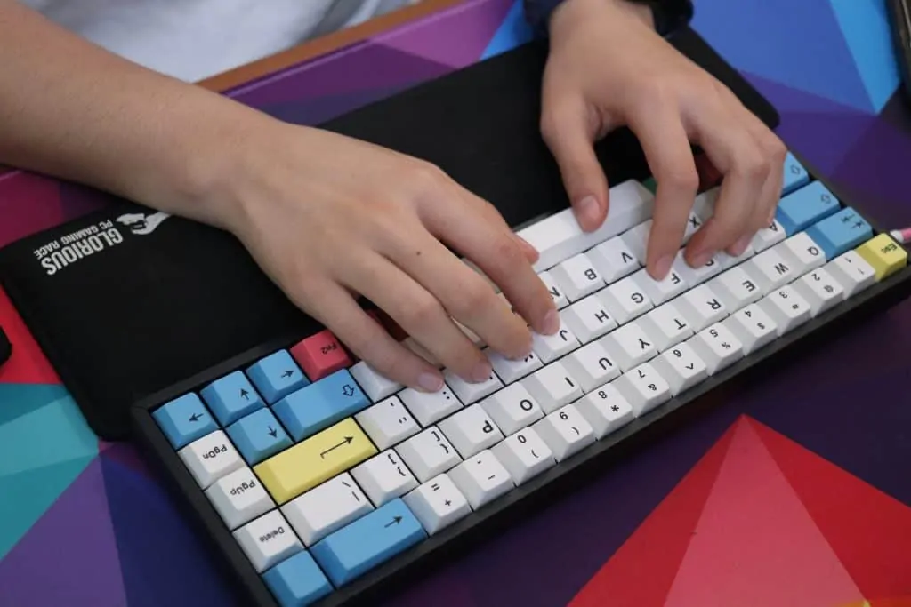 Typing on Keychron K6 wireless mechanical keyboard with a wrist rest