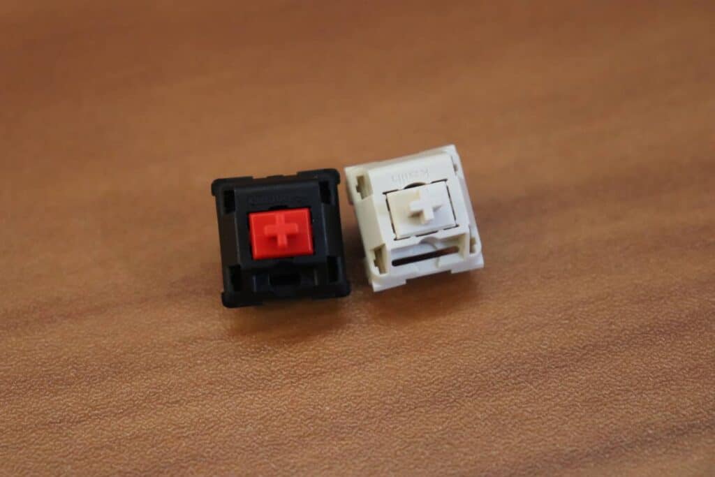 Cherry MX Red switch next to Novelkey cream switch