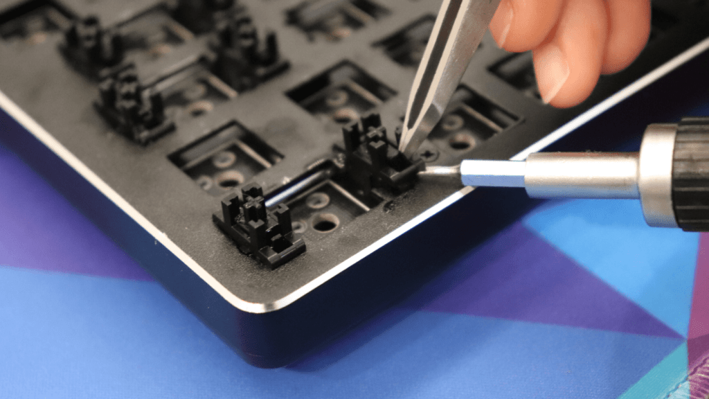 Removing a plate-mounted stabilizer from a keyboard