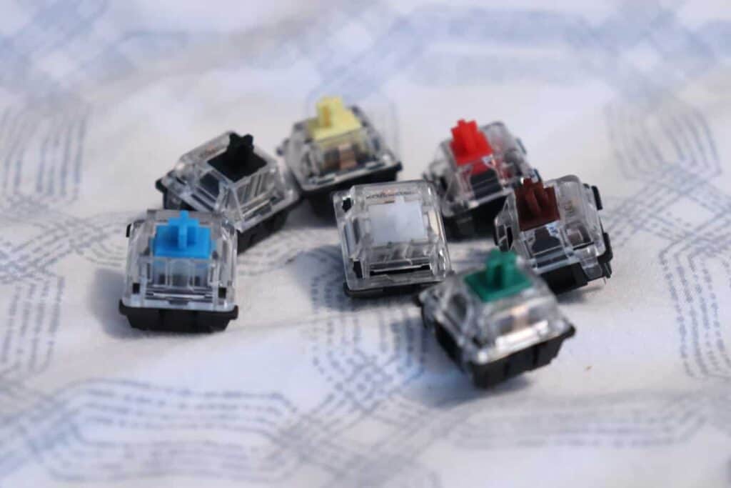 A variety of Gateron switches on a deskmat.