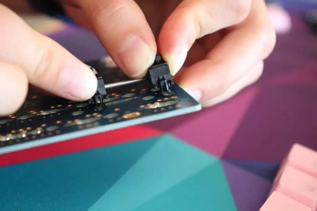 Keyboard stabilizer being put on a keyboard