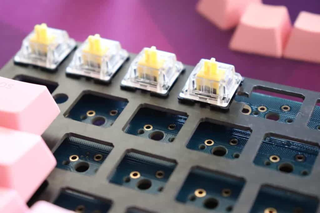 Installing switches into keyboard PCB.