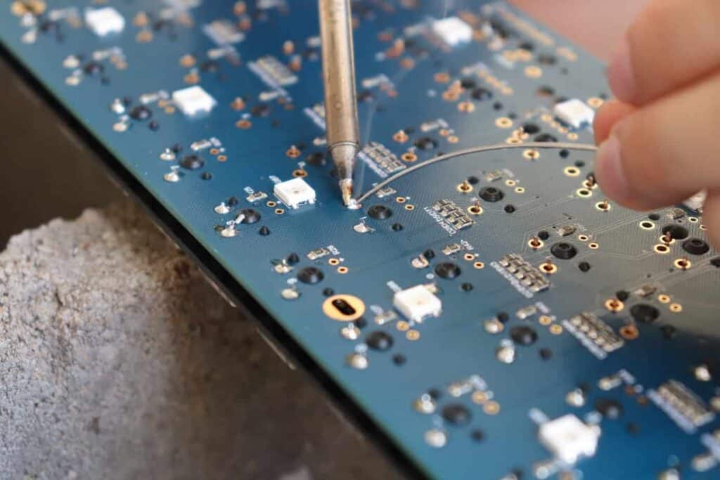 desoldering switches from mechanical keyboard using leaded solder and a soldering iron