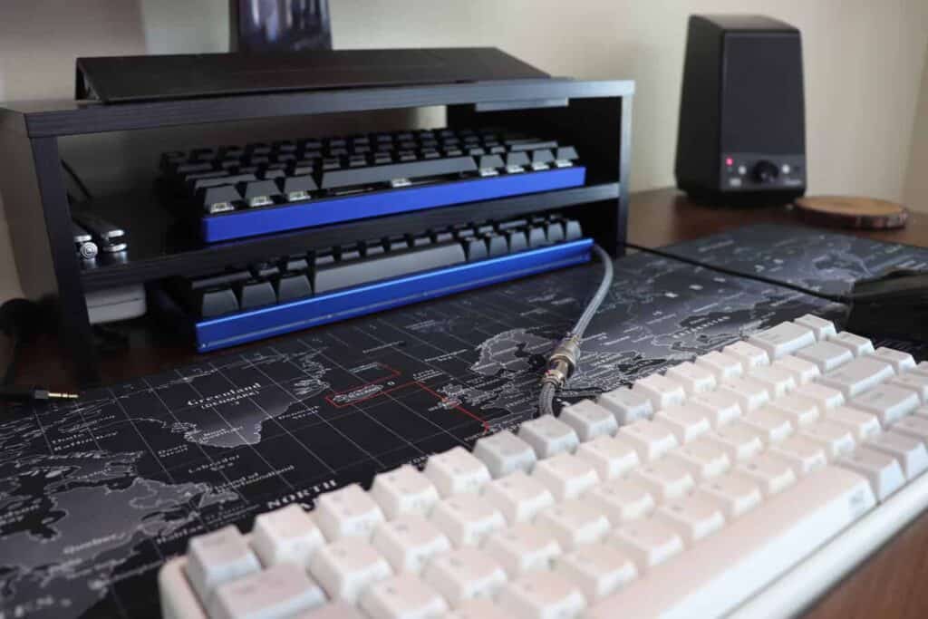 monitor and keyboard stand on desk