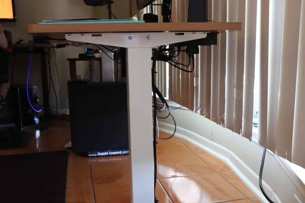 A standing desk with a PC setup.