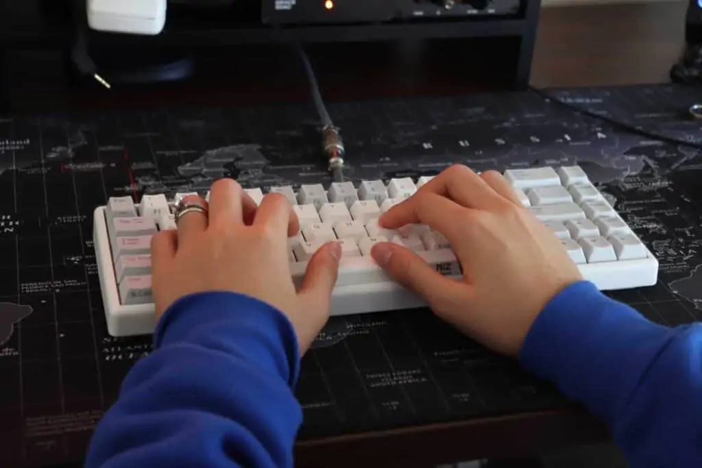 someone typing on mechanical keyboard