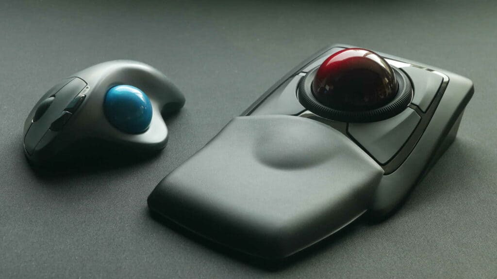 Thumb trackball next to a finger trackball mouse