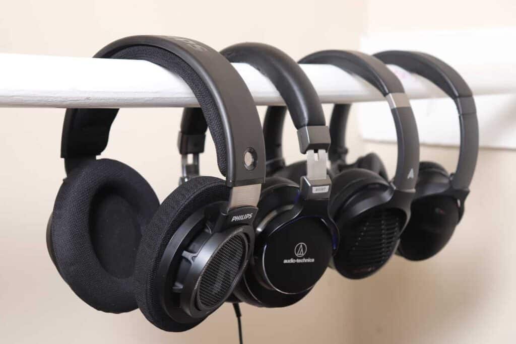 Variety of headphones hanging next to each other