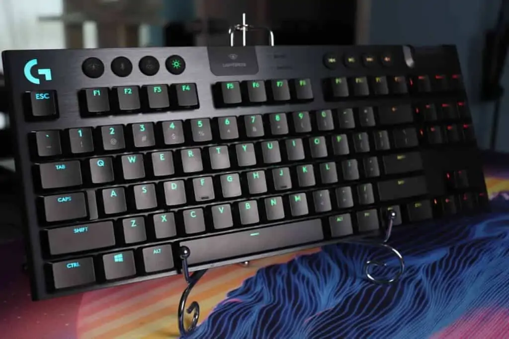 Logitech G915 TKL sitting on a keyboard stand