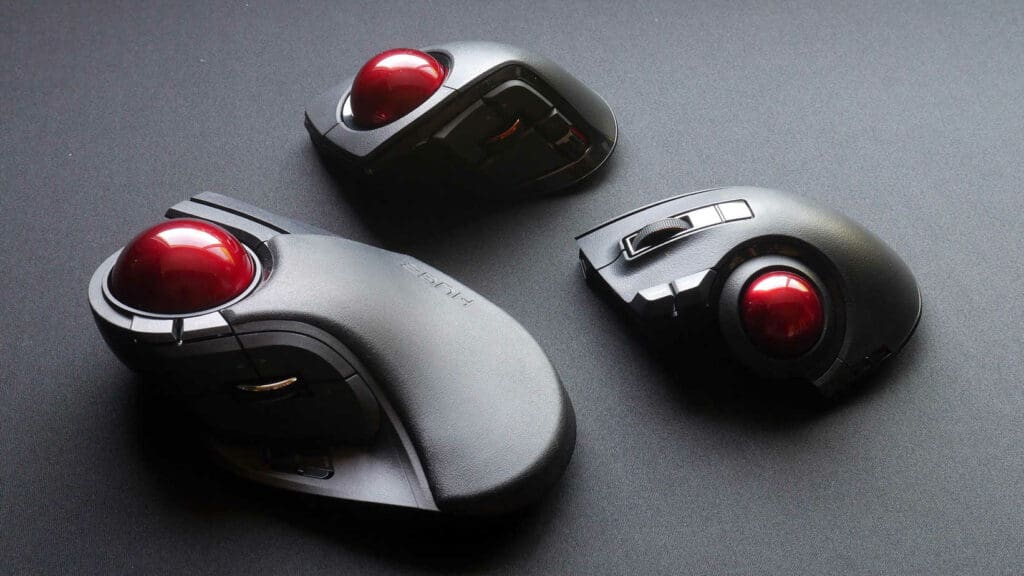 Variety of Elecom trackballs next to each other on a desk